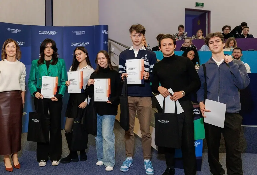 Prize winners holding certificates at Skolkovo School of Management