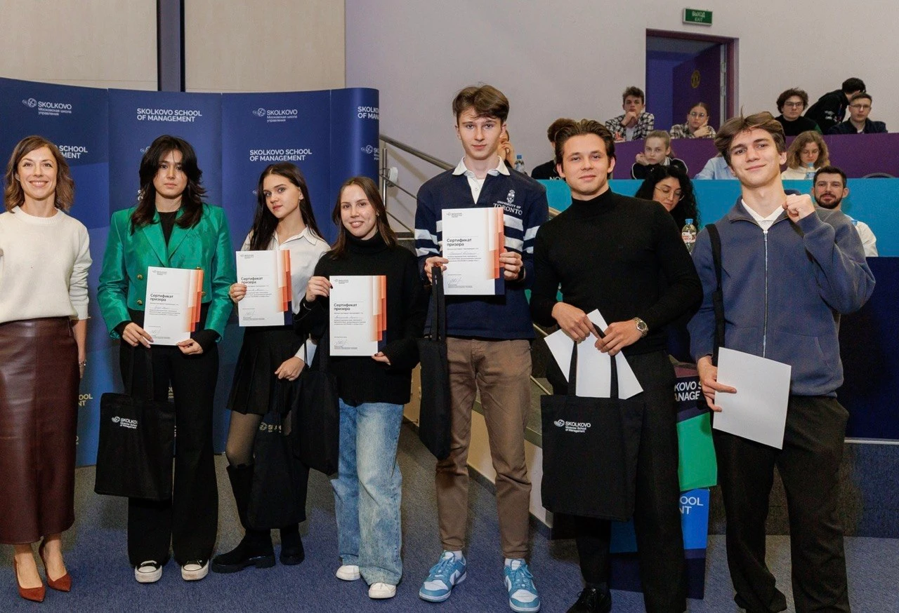 Prize winners holding certificates at Skolkovo School of Management